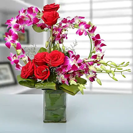 Orchids And Roses In Glass Vases